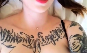tattooed-teen-with-big-boobs-slides-a-dildo-down-her-throat